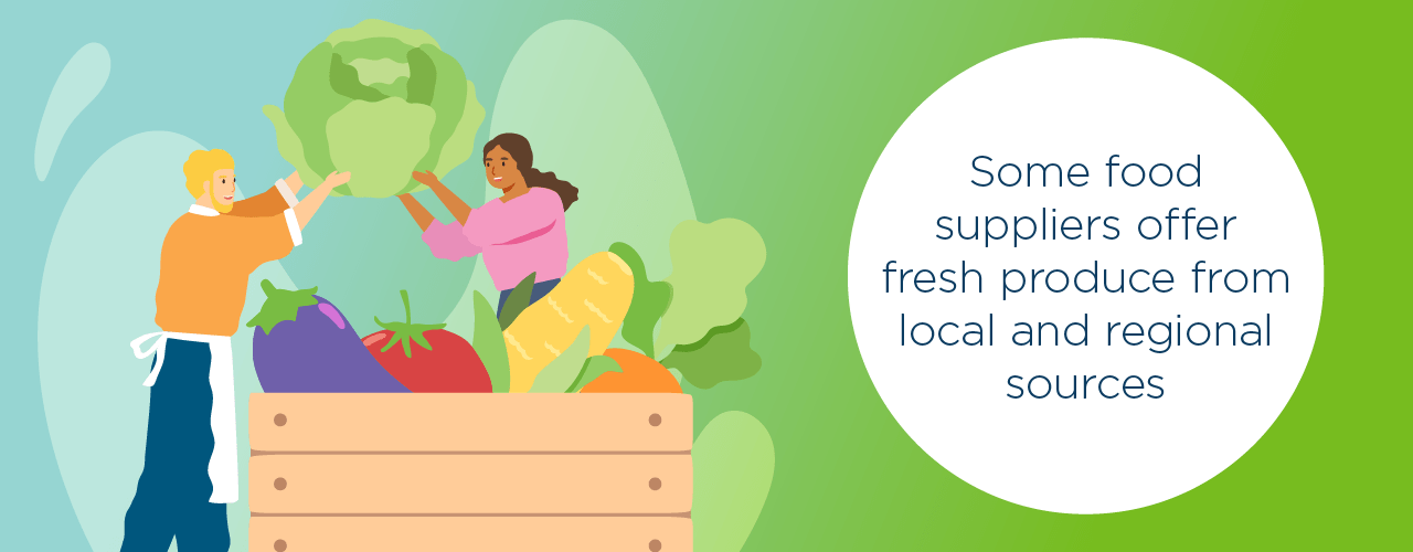 two people holding a head of lettuce above a crate of other vegetables