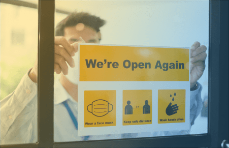 healthcare worker putting sign up with guidelines for re-entry