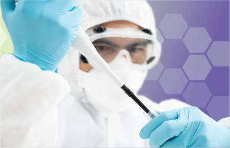 Person wearing full personal protective equipment hazmat suit with goggles using a pipet