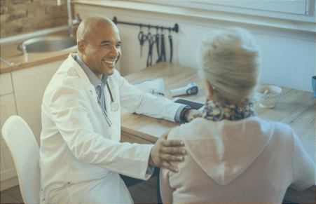 Doctor with patient at house call