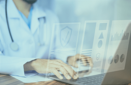 Doctor typing on computer