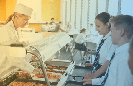Student with lunch tray getting lunch from the chef