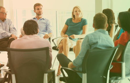 Group of  office workers sitting in a circle
