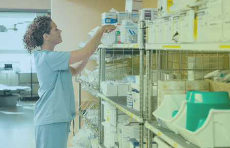 Pharmacy technician or nurse looking at inventory stock