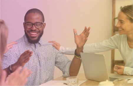 People on a team smiling and happy