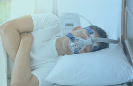 man sleeping with cpap machine