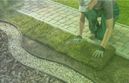 Landscaper laying out fresh grass