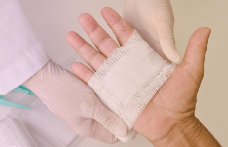 hand wrapped in gauze