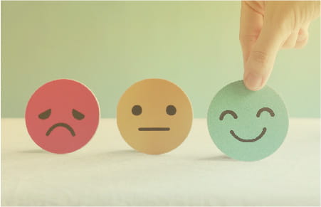icons for red sad face, yellow neutral face and green happy face