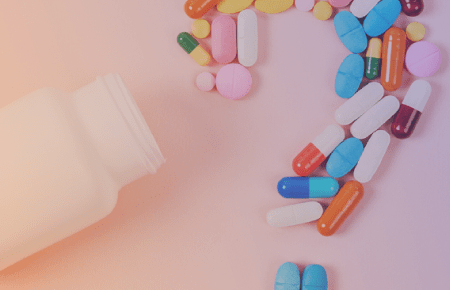 Pills arranged into a question mark