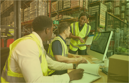 coworkers in factory at computer