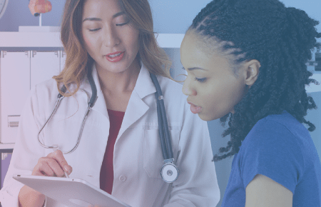 Female doctor with female patient-450X290