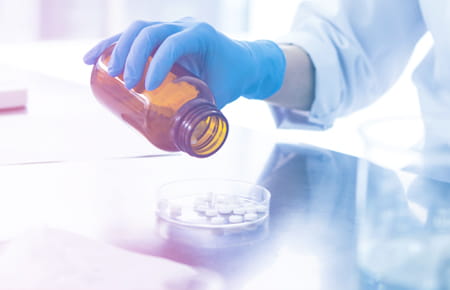 Pouring pills out of bottle