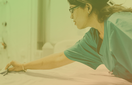 Nurse making a patient bed